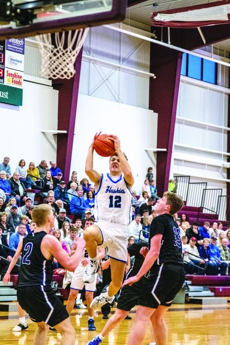 Alex Scarmon flies through the lane to garner two points against Waubay/Summit. Photo by Peterman Sports Photography stevepeterman5@gmail.com