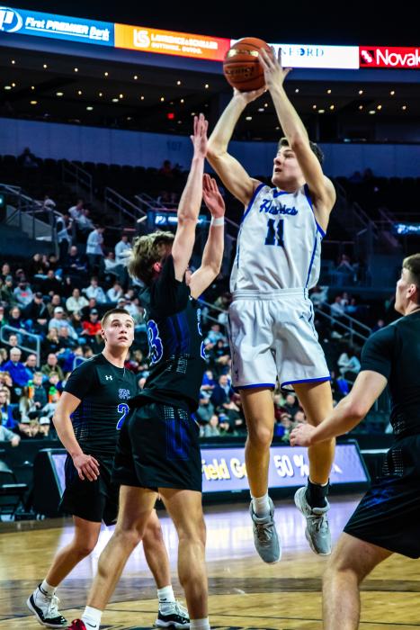 Jakob Scarmon attacks the basket against Sioux Falls Christian at the Class A State Basketball tournament.  Photo by Peterman Sports Photography • stevepeterman5@gmail.com