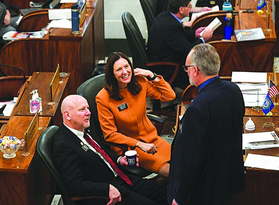 South Dakota Sens. Helene Duhamel and Jim Mehlhaff, both Republicans, speak with Sen. Reynold Nesiba, a Democrat, on Jan. 10, 2023, at the state Capitol in Pierre.