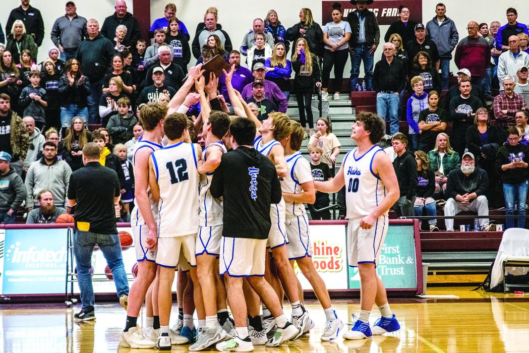 The Elk Point-Jefferson Huskies gather in camaraderie as they celebrate their win over the Waubay/Summit Mustangs. Photo by Peterman Sports Photography stevepeterman5@gmail.com