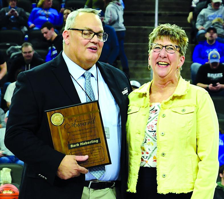 Barb Haberling was presented with the SDHSAA Distinguished Service Award during the State A Boys Basketball tournament. Photo courtesy of South Dakota Public Broadcasting
