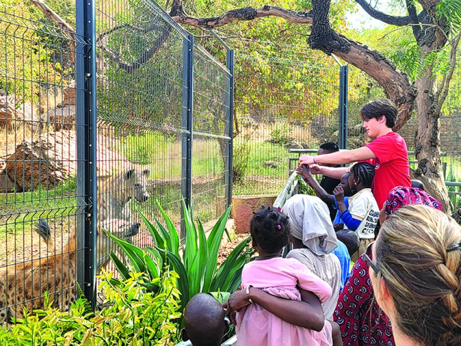Tyler at the zoo with children from the orphanage. Submitted photo