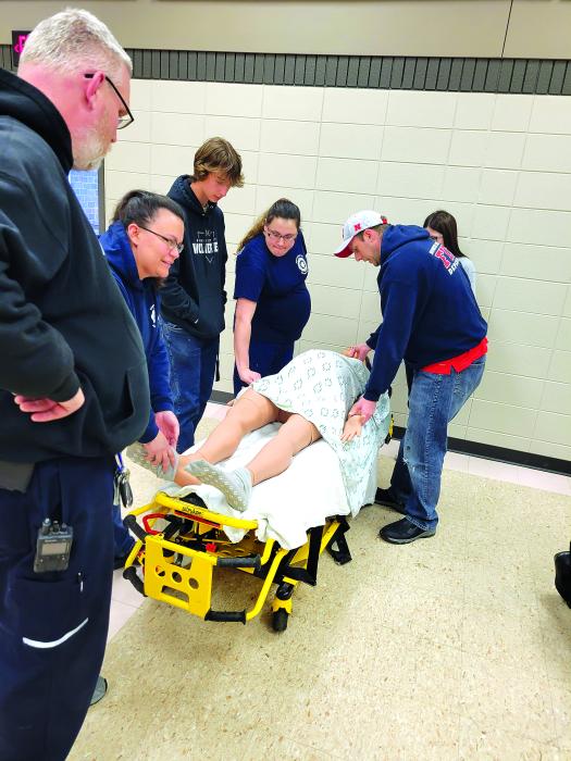 One of the trainings conducted were a simulation of child birth. Pictured, from left, Tim Bell, Lead Paramedic Jackie Burke, Carter Jelken, Kendra Schamber, Jadyn Chartier and Viktor Sundlief. Submitted photo