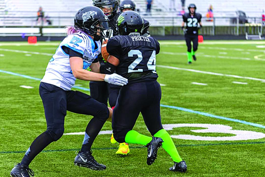 Jacki Waldner (in white) goes to tackle the opponent. Photo submitted
