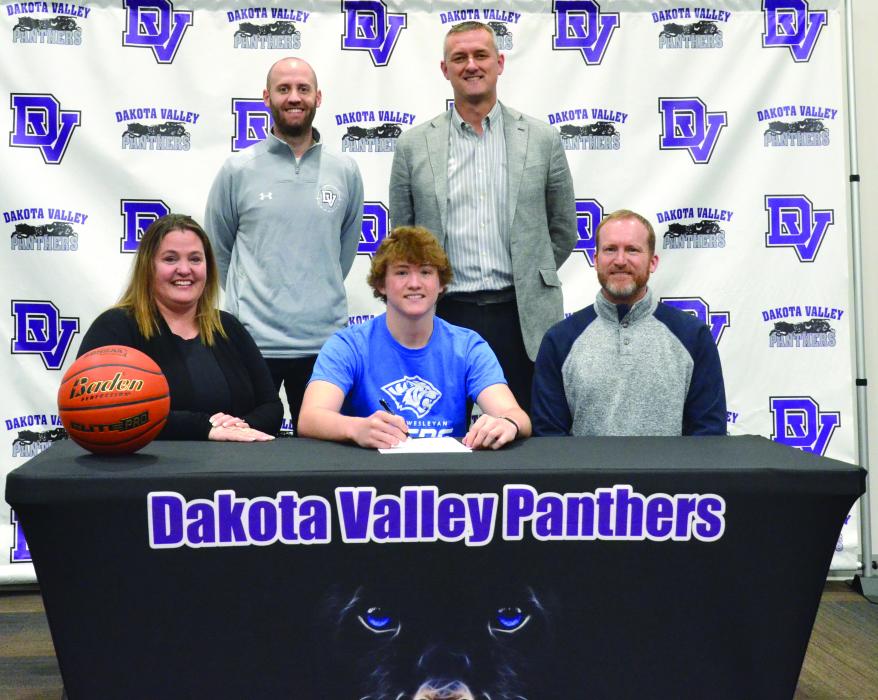 Jaxon Hennies signed to play basketball with DWU.There to witness the signing were front,from left, Amy Hennies, Jaxon Hennies and Jason Hennies; and back, DV Assistant Basketball Coach Trae Bergh and DV Head Basketball Coach Jason Kleis. Photo by Kelly Riibe • times1reporter@gmail.com