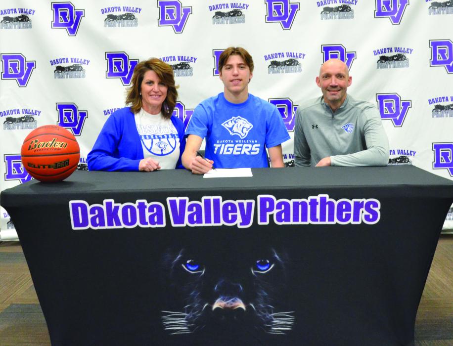 Randy Rosenquist signed to play basketball with DWU. Present for the signing were, from left, Brenna Layhee Rosenquist, Randy Rosenquist and DWU Coach Matt Wilber. DV Basketball coaches Jason Kleis and Trae Bergh were present, but not pictured. Photo by Kelly Riibe • times1reporter@gmail.com
