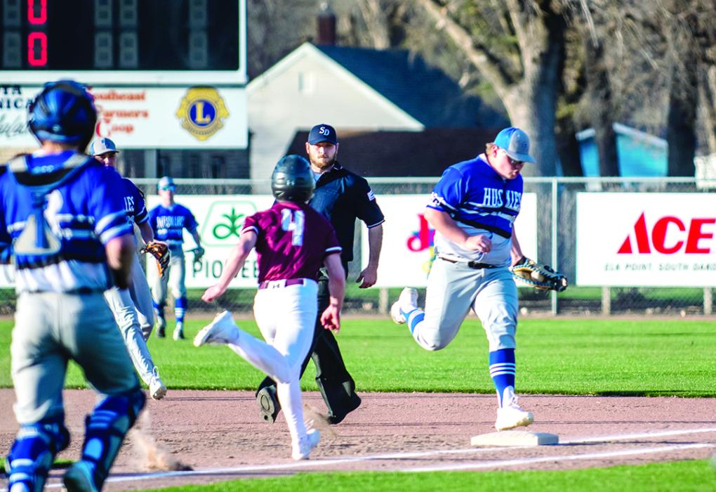 Ty Trometer beats the runner to first base to secure the out. Photo by Peterman Sports Photography stevepeterman5@gmail.com