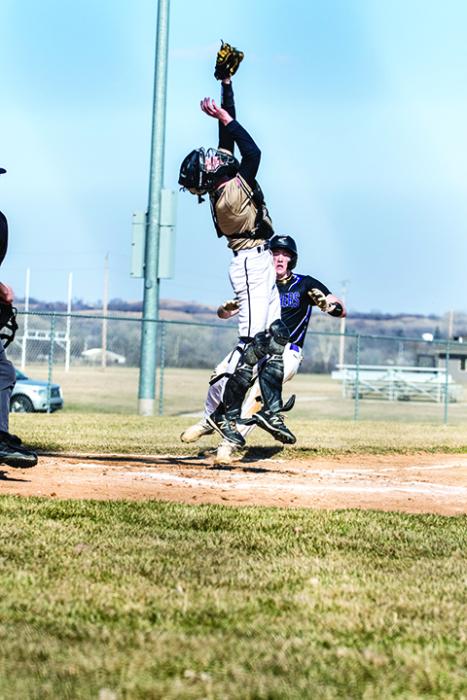 Jaxon Hennies beats the throw to home plate to score for the Panthers. Photo by Peterman Sports Photography stevepeterman5@gmail.com