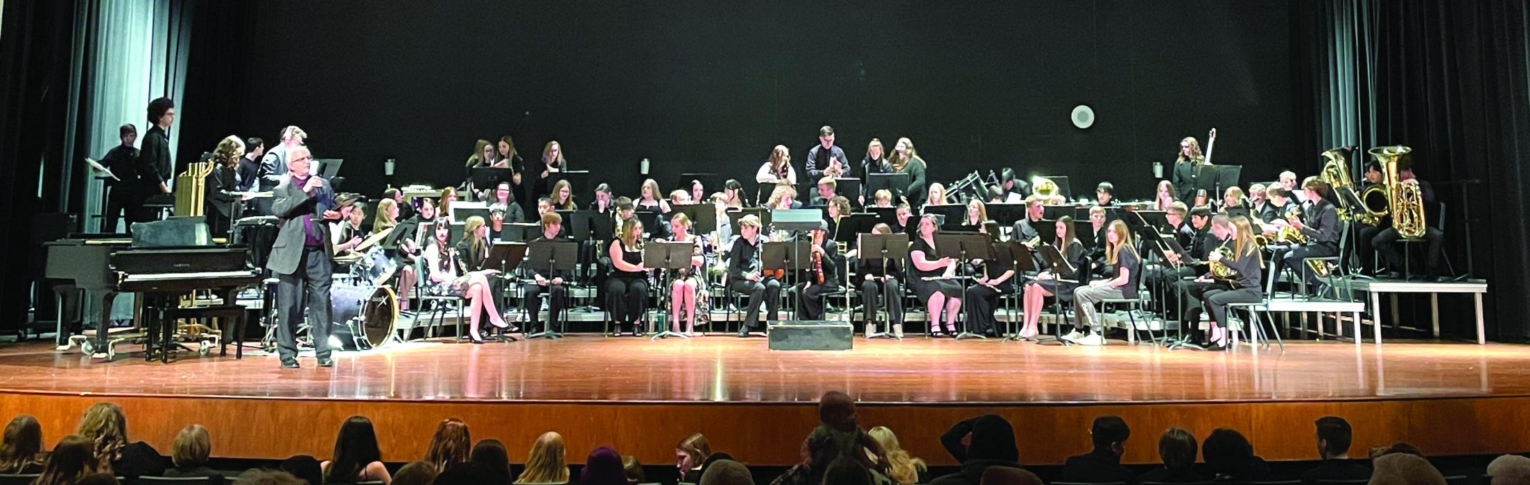 Band Director Daryl Jessen speaks to the crowd as the DV band gets ready to perform at the High School Concert April 21. Submitted photo