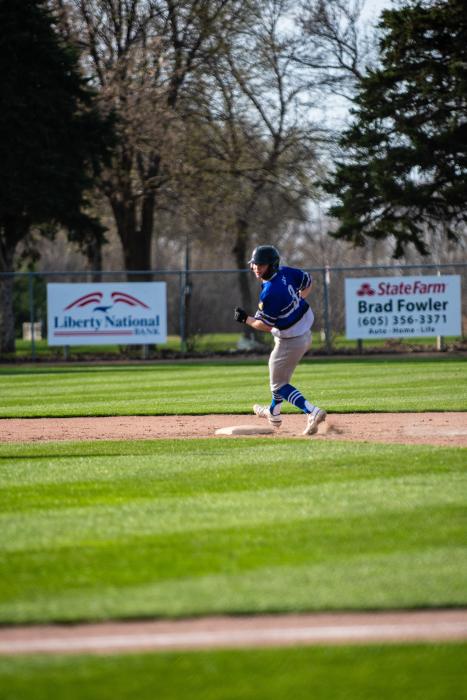 Jake Gale watches over his shoulder as he safely steals second base against DV last week. Photo by Peterman Sports Photography • stevepeterman5@gmail.com