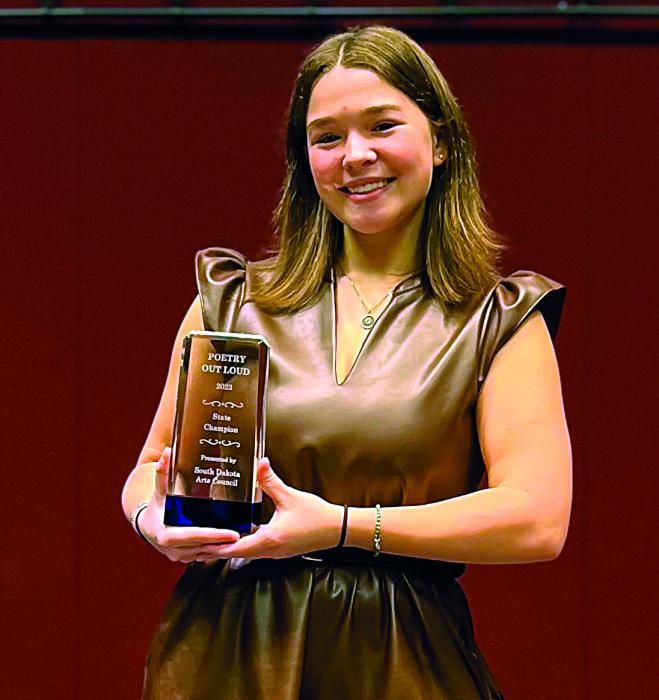 Grace Powell smiles as she showcases her State Championship trophy from Poetry Out Loud. Submitted photo