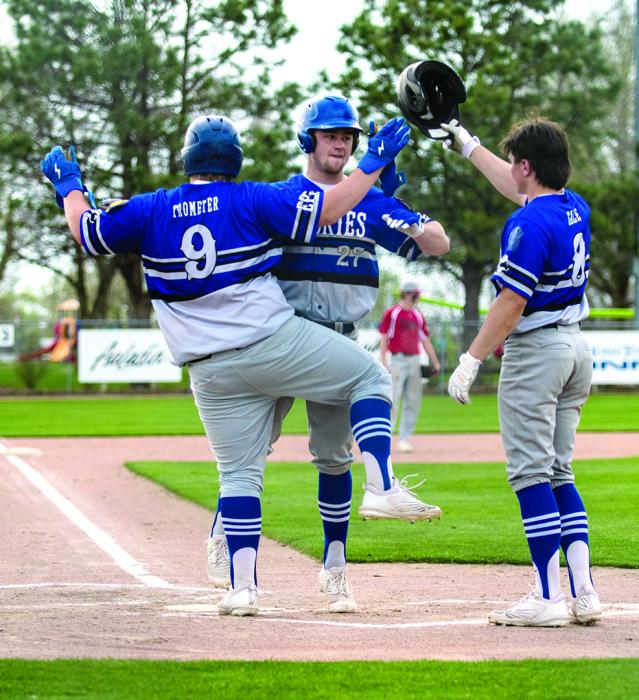 Ben Swatek celebrates at home plate with Ty Trometer and Keaton Gale after getting a homerun against Freeman/Canistota. Photo by Peterman Sports Photography • stevepeterman5@gmail.com