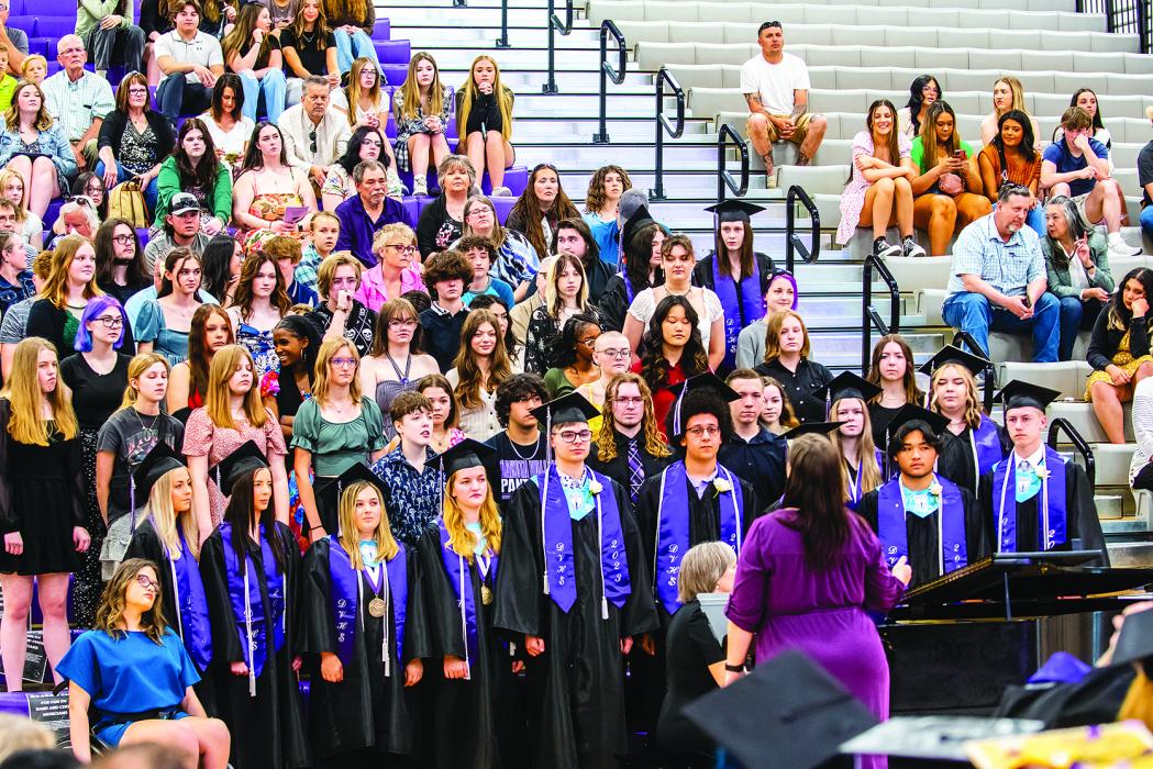 At Dakota Valley graduation ceremonies May 13, the DV High School Choir, left, sang 'I Am Still Your Dreamer' by Pink Zebra. Joshua Ganschow, right, gave a commencement address during the ceremony. More photos on page 14. Photo by Peterman Photography • stevepeterman5@gmail.com