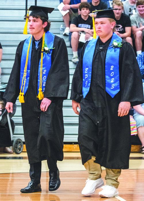 Devon Schmitz and Ty Trometer walk into the gymnasium at the beginning of graduation. Photos by Peterman Photography stevepeterman5@gmail.com