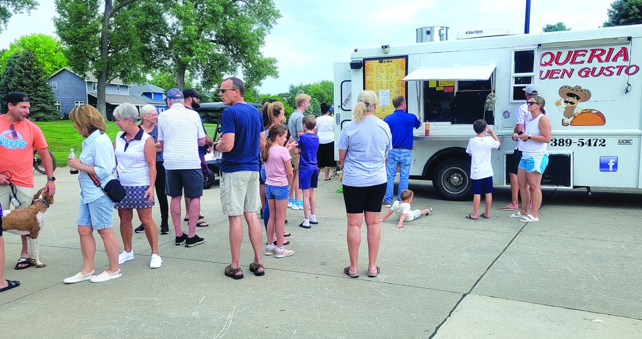 Residents enjoyed the nice weather, fun atmosphere and good food at 'Food Trucks in the Park' on Sunday, June at the Prairie Park in Dakota Dunes. They enjoyed food from Taqueria El Buen Gusto. Photo by Kelly Riibe • times2reporter@gmail.com