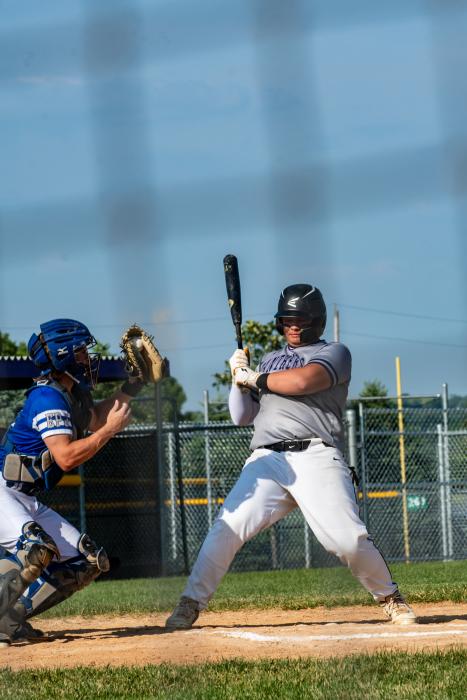 Jake Pruchniak leans back to avoid a high pitch. Photo by Peterman Sports Photography stevepeterman5@gmail.com