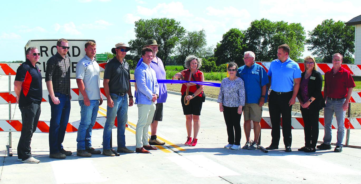 A Ribbon Cutting was held for the grand opening of the Sioux Point Road after the realignment project was completed June 22. The road officially opened after the ribbon cutting at 4 p.m. Present were members of the construction crew, North Sioux City City Council, North Sioux City Economic Development Corporation, Dakota Valley Business Council and Stockwell Engineering. Photo by Beth Hutcheson • timesreporter1@gmail.com