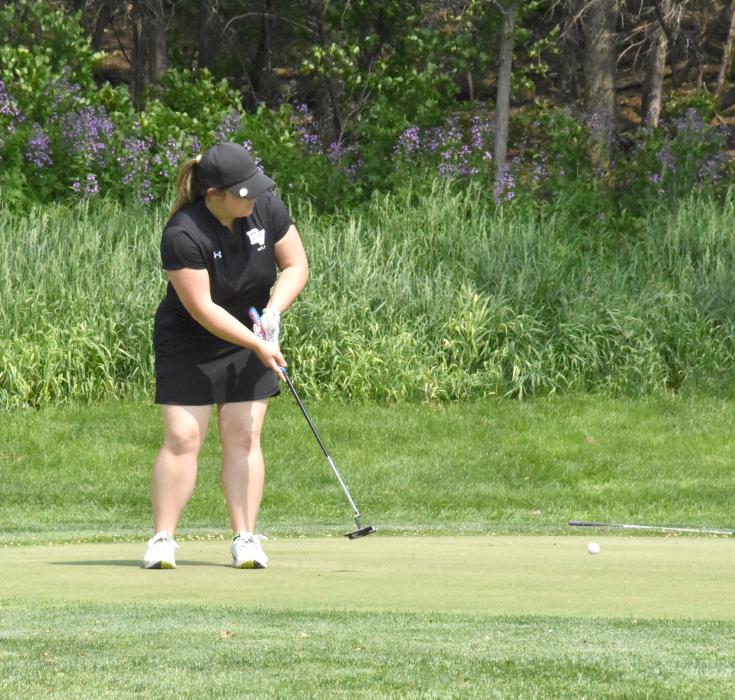 Senior Lexi Squier putts during the conference meet in Vermillion May 22. Photos courtesy of Randy Uhl