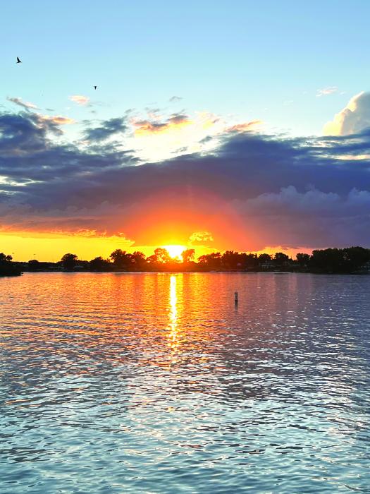 A glorious orange sunset could be seen across the area on Saturday, June 24. This photo was captured as the sun set behind McCook Lake. Photo courtesy of Julie Burhoop