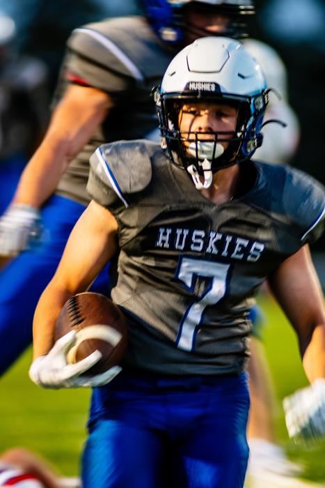 Gunner Ewing gets a touchdown for the Huskies after a 15-yard run.