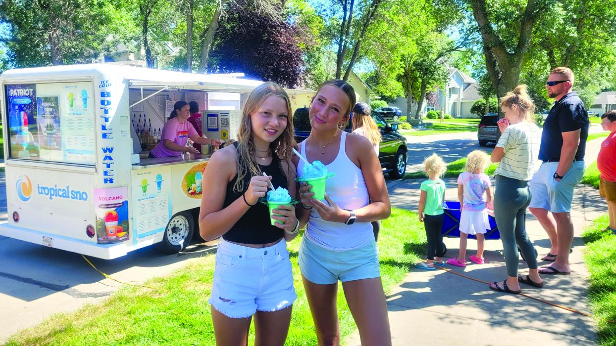Gabby Uhl, Suri Uhl enjoy “Snowcones in the Park” at the Meadows Park of Dakota Dunes on Saturday, August 12. Photo by Kelly Riibe • times2reporter@gmail.com