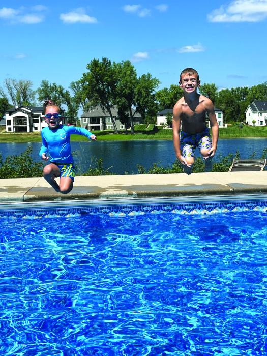 Bayleigh and Brecken Markve were beating the heat after school last week at their grandparent’s pool on Spanish Bay in Dakota Dunes. Submitted photo