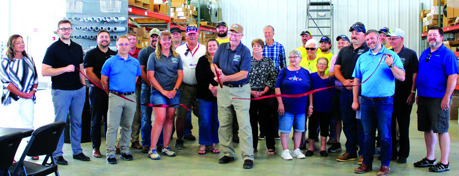 Union County Electric Cooperative Board Member Don Schurdevin cuts the ribbon at the electric company’s new building Grand Opening Aug. 8. Also pictured are members of the Elk Point Chamber and U.S. Senator John Thune. Photo by Beth Hutcheson • times1reporter@gmail.com 