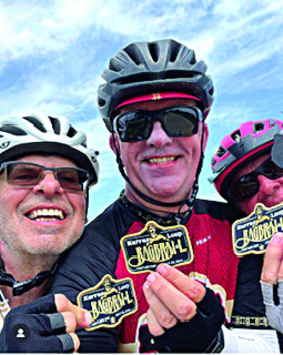 Rob Skime, Perry Ping and Timothy Jacobs rode the 100 mile loop of RAGBRAI and received patches.