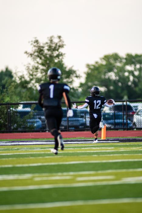 Jackson Boonstra runs the ball in for the first touchdown of the season against Vermillion Aug. 25.