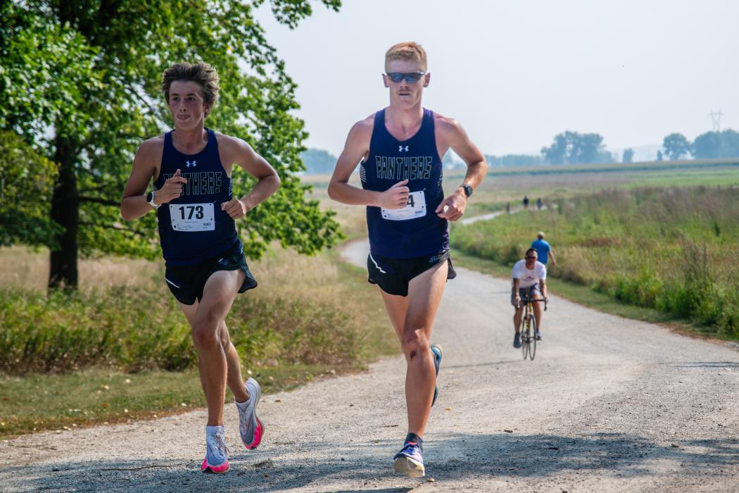Jack Brown and Joe Cross run side by side at the Dakota Valley Invite Aug. 29. Brown took 1st place and Cross followed with 2nd place.  Photo by Peterman Sports Photography   stevepeterman5@gmail.com