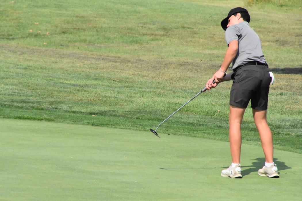 Matt DeBeer putts at The Bluffs Golf Course in Vermillion.  Photo by Randy Uhl