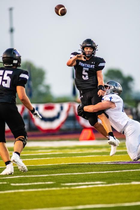 Top right) Drew Lukken gets off a pass before being sacked Sept. 8. Photo by Peterman Sports Photography • stevepeterman5@gmail.com