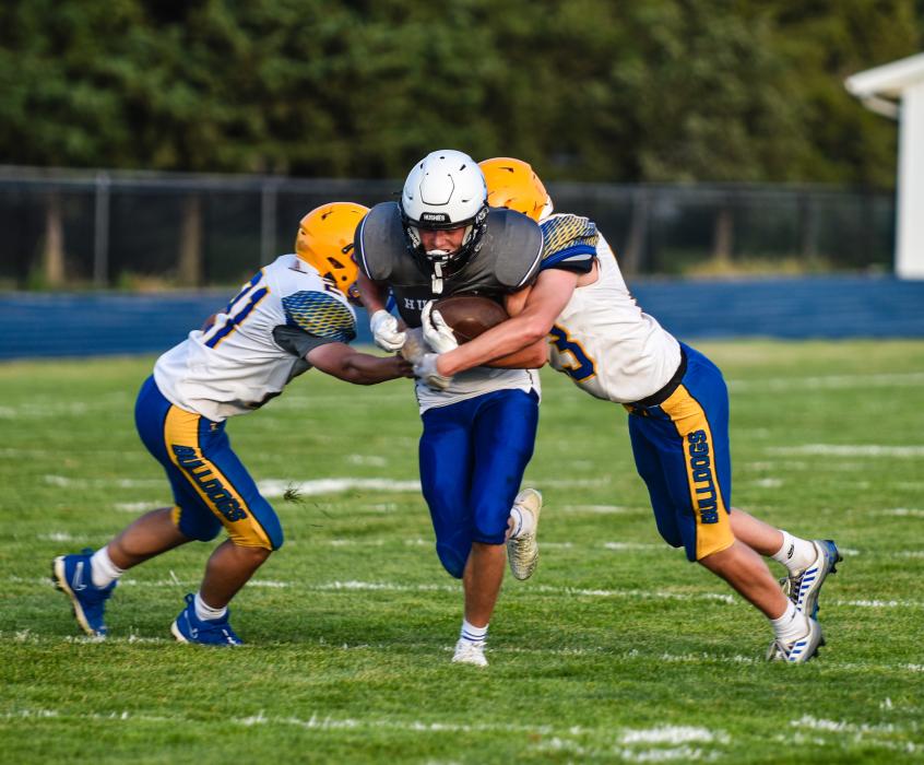Kayden Moore catches the ball and gains 10 yards against Baltic Aug. 25. Photo by Peterman Sports Photography stevepeterman5@gmail.com