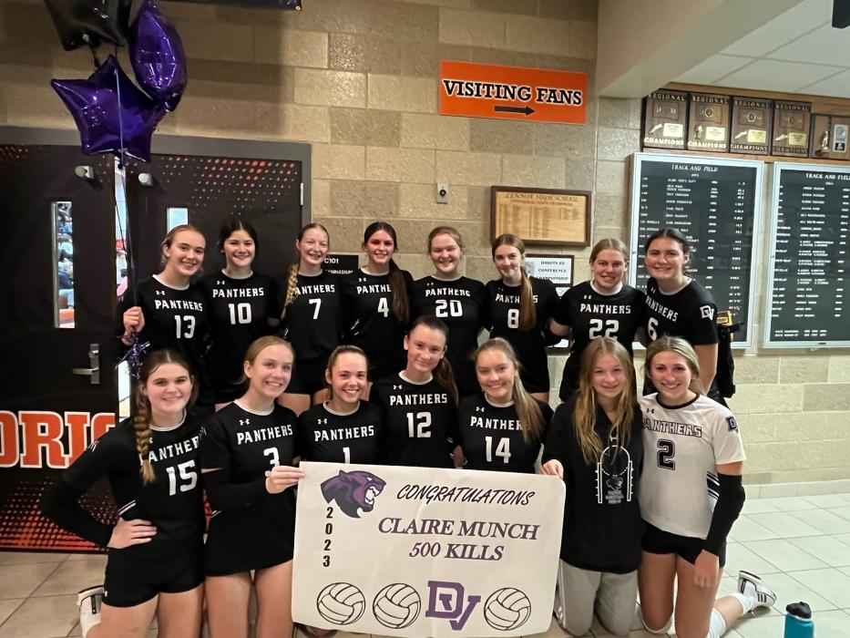 Sophomore Claire Munch earned her 500th kill on Oct. 10 versus Lennox and the team celebrated her success at the net on Oct. 14 during conference tourney play. Submitted photo