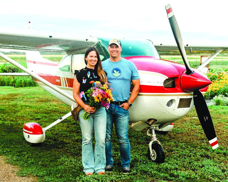 Christy Heckathorn his pictured with her husband, Chad, in front of their plane. A unique aspect of Fleurish Flower Farm is that there is a grass runway for planes at the back of the property. Photos courtesy of Christy Heckathorn