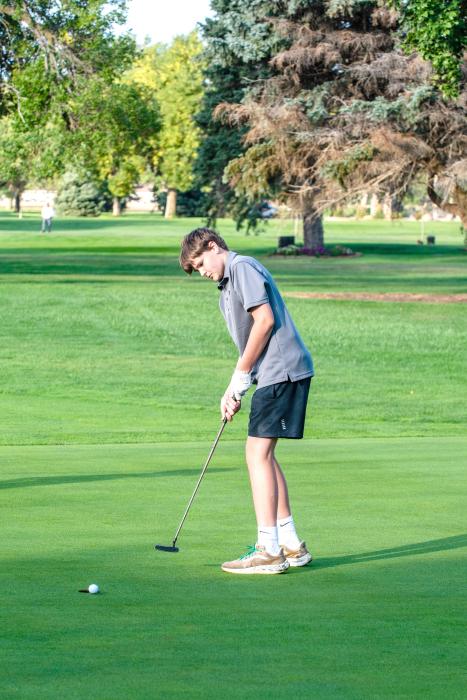 Eli Connors sinks a putt during the Husky Invite Sept. 14. Photo by Peterman Sports Photography stevepeterman5@gmail.com