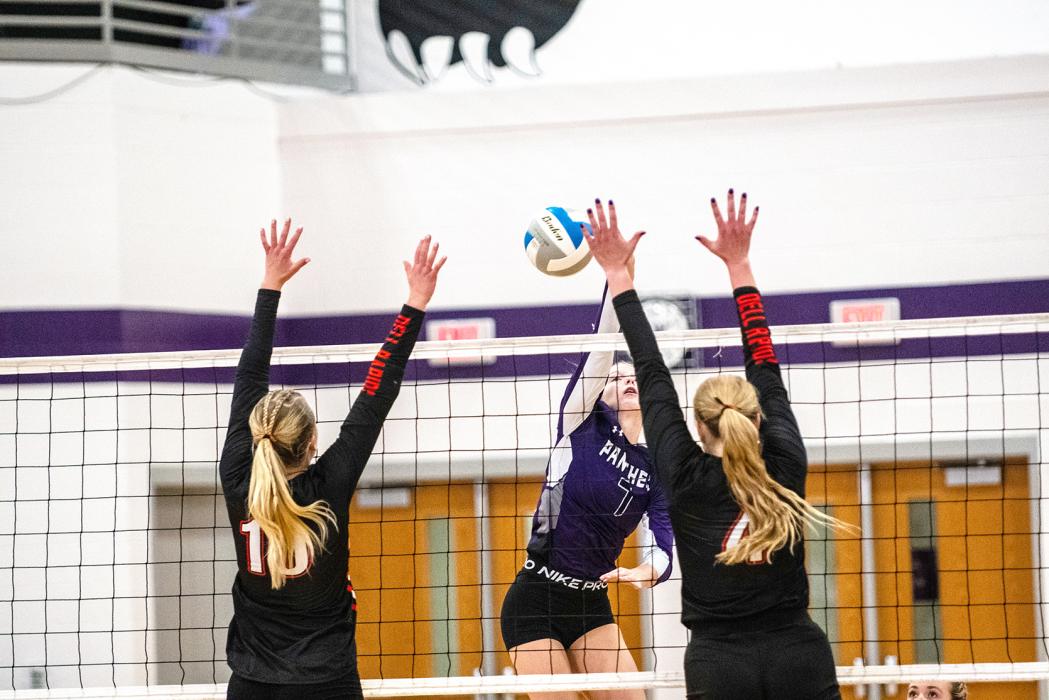 Sammy Kimbell splits the Dell Rapids block Oct. 2 to get a kill. She led the team in kills with 13. Photo by Peterman Sports Photography • stevepeterman5@gmail.com