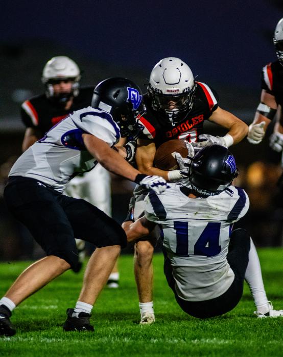 Brayden Stivers and Trae Piel go in for the tackle. Photo by Peterman Sports Photography stevepeterman5@gmail.com
