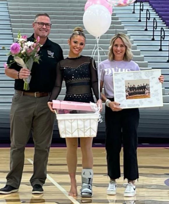 The Dakota Valley Dance team honored their senior member, Megan Poulsen Oct. 7 at the Dakota Valley Dance Invite. She was joined by her parents Jeremy and Talli Poulsen. Submitted photo