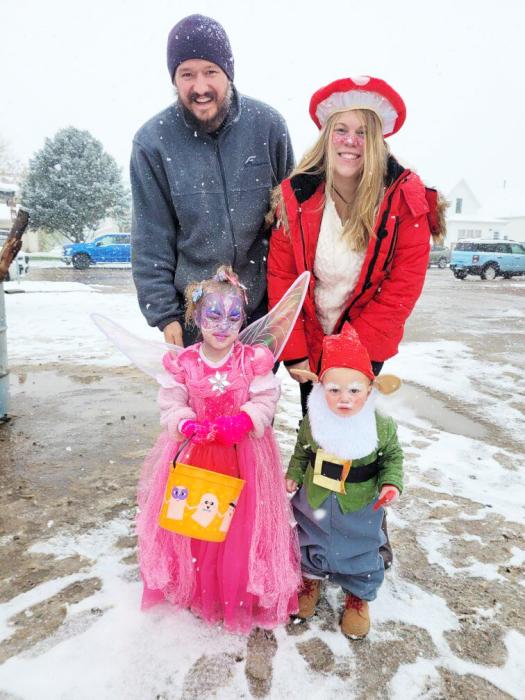 This family braved the cold so their fairy princess and little gnome could collect some candy. Submitted photo