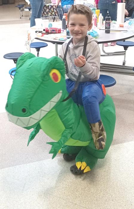 This boy and his dinosaur enjoy a treat from the Elk Point Library’s pumpkin painting event Oct. 28. Submitted photos