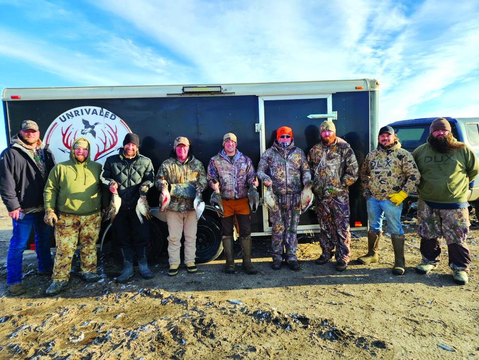 Unrivaled Tradition Outdoors led a waterfowl hunt for three local veterans Oct. 27-29. Pictured are, from left, Jarred Peterson, Josh Rupp, Jason Muhlbauer, Mike Otkin, Jake Otkin, Dustin Wagner, Tory Norby, Andrew Teply and Brad Irwin. Photo courtesy of Unrivaled Tradition Outdoors