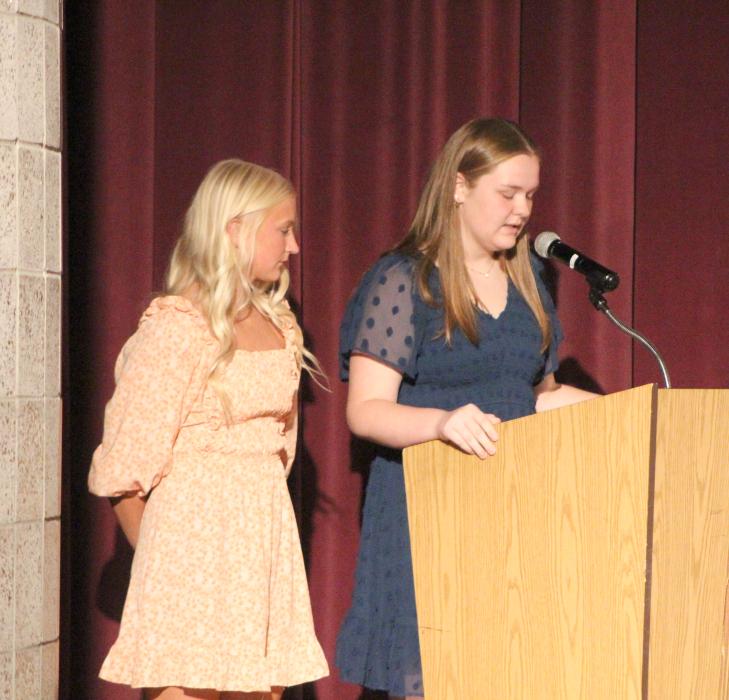 DV NHS Student President Lauren Olhausen speaks at the induction ceremony on Oct. 16 as president-elect Ella Schmiedt stands at her side. Submitted photo