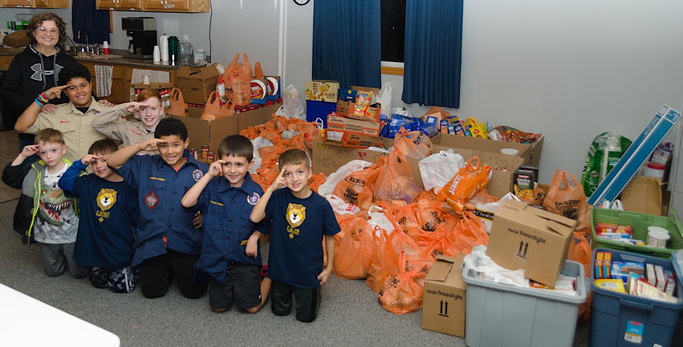 Elk Point-Jefferson Cub Scout Pack 87 dropped off food to the Elk Point Food Pantry. The food was collected from their Scouting for Food event held Nov. 1-12. Pictured above is Food Pantry Director Tam Edgar, the cub scouts and their donation of food. Submitted photo