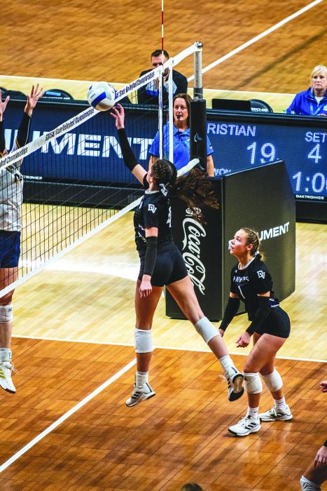 Emersen Mead uses a soft touch to put the ball over the net during the opening round in the State Class A Volleyball Tournament against Rapid City Christian Nov. 16 in Rapid City. Photo by Peterman Sports Photography stevepeterman5@gmail.com