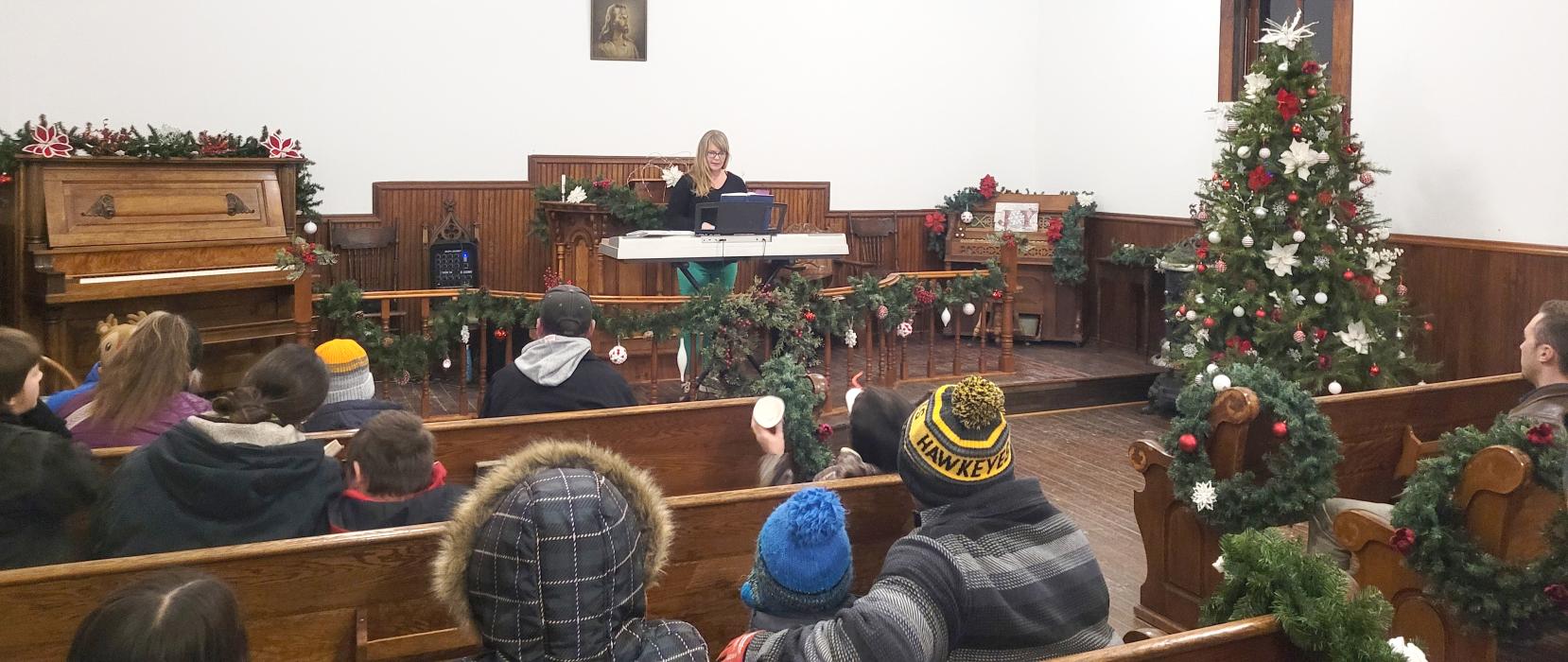 Amanda VandeZande, of Jefferson, played and sang in the church building for Homestead Holidays. Photo by Kelly Riibe • times2reporter@gmail.com