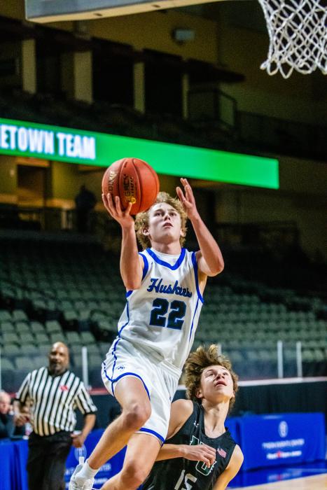 Kayden Moore shows good form, despite the contact, as he goes in for a layup against North Union Dec. 16. PhotobyPetermanSportsPhotography•stevepeterman5@gmail.com