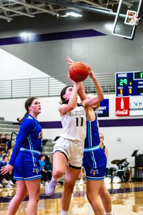 Cameryn Sommervold draws the foul and gets a 3-point play against Canton Dec. 15 Photo by Peterman Sports Photography stevepeterman5@gmail.com