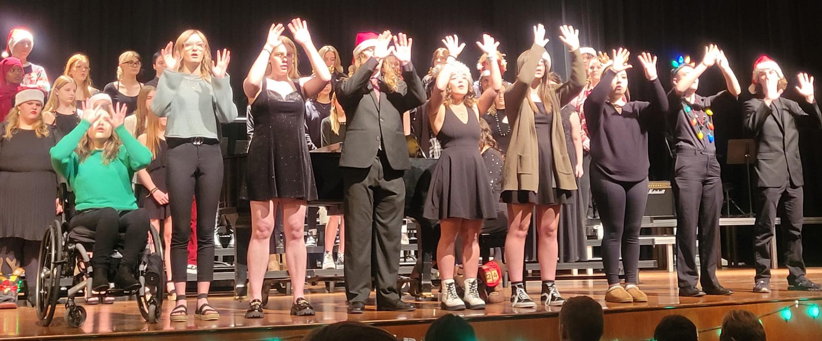 The senior choir students did sign language while performing “Stille Nacht” at the holiday concert on Dec. 1. The seniors, from left, are Karlee Hughes, Madisen Bell, Stella Carlson, Kaleb Haiar, Grace Powell, Madisen Grooms, Qiara Bruguier, Ollie Hermes and Lewis Pick. Submitted photo