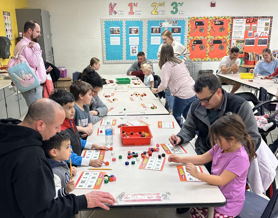 Dakota Valley Elementary School students and parents attend Family Math Night on Nov. 16. Pictured above, parents and children play Bingo inside one of the classrooms. Submitted photo